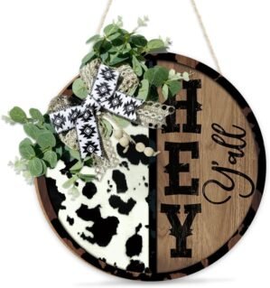 Putuo Decor Hey Y’all Cow Print Door Sign Round Farmhouse Welcome Sign with Greenery Bow, Rustic Western Style Front Door Hanger for Porch, Entryway, Barn, or Home Decor, 12 Inch